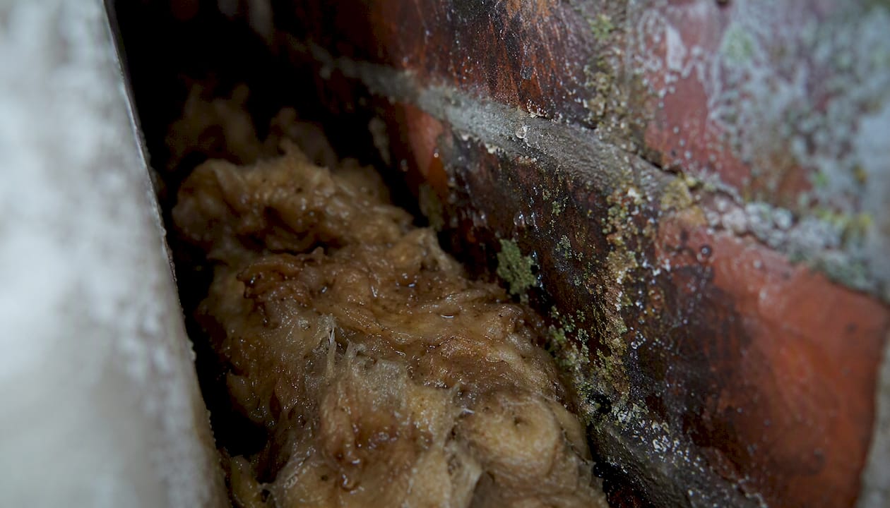 Saturated mineral wool insulation in cavity wall