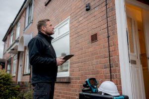 Retrofit coordinator assessing UK home
